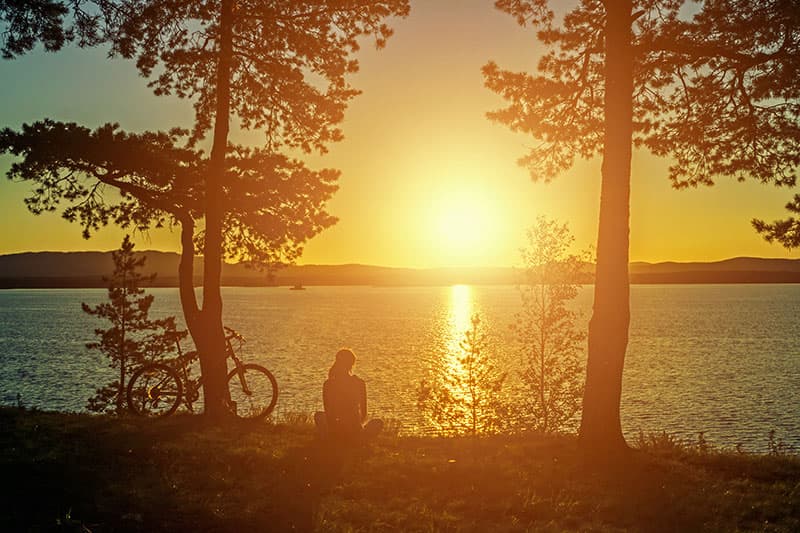 Watching the sun set over a lake