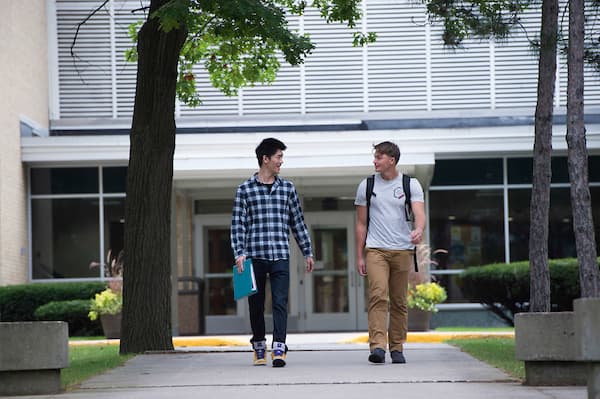 Students exiting a Marinette campus building