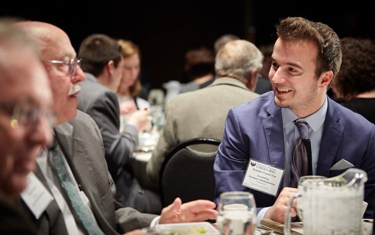 student at business luncheon