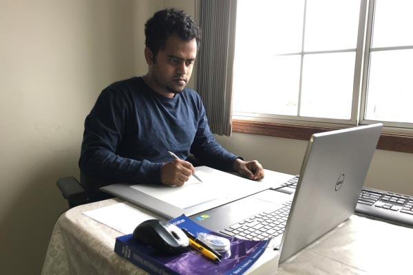 Faculty member teaching online from home duing the COVID-19 pandemic