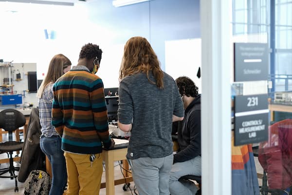 students congregating and working