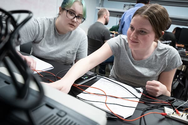 Women studying electrical engineering