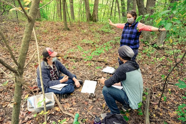 Professor helps students gather soil samples