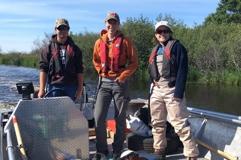 Three people on a boat