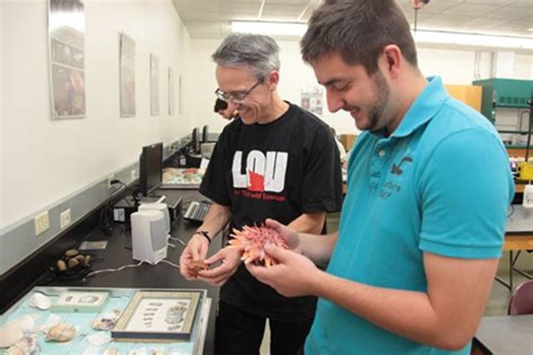 Student with professor in class.