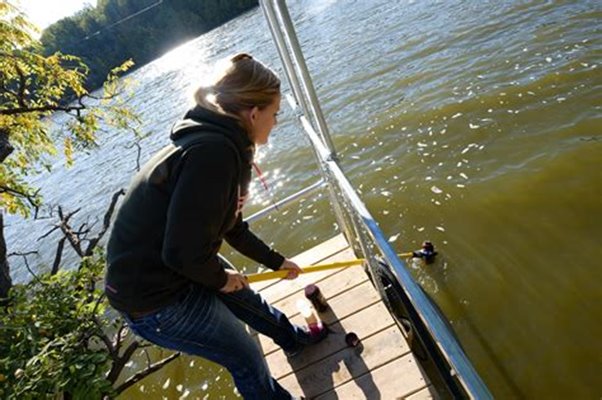 Student conducting research in the field.