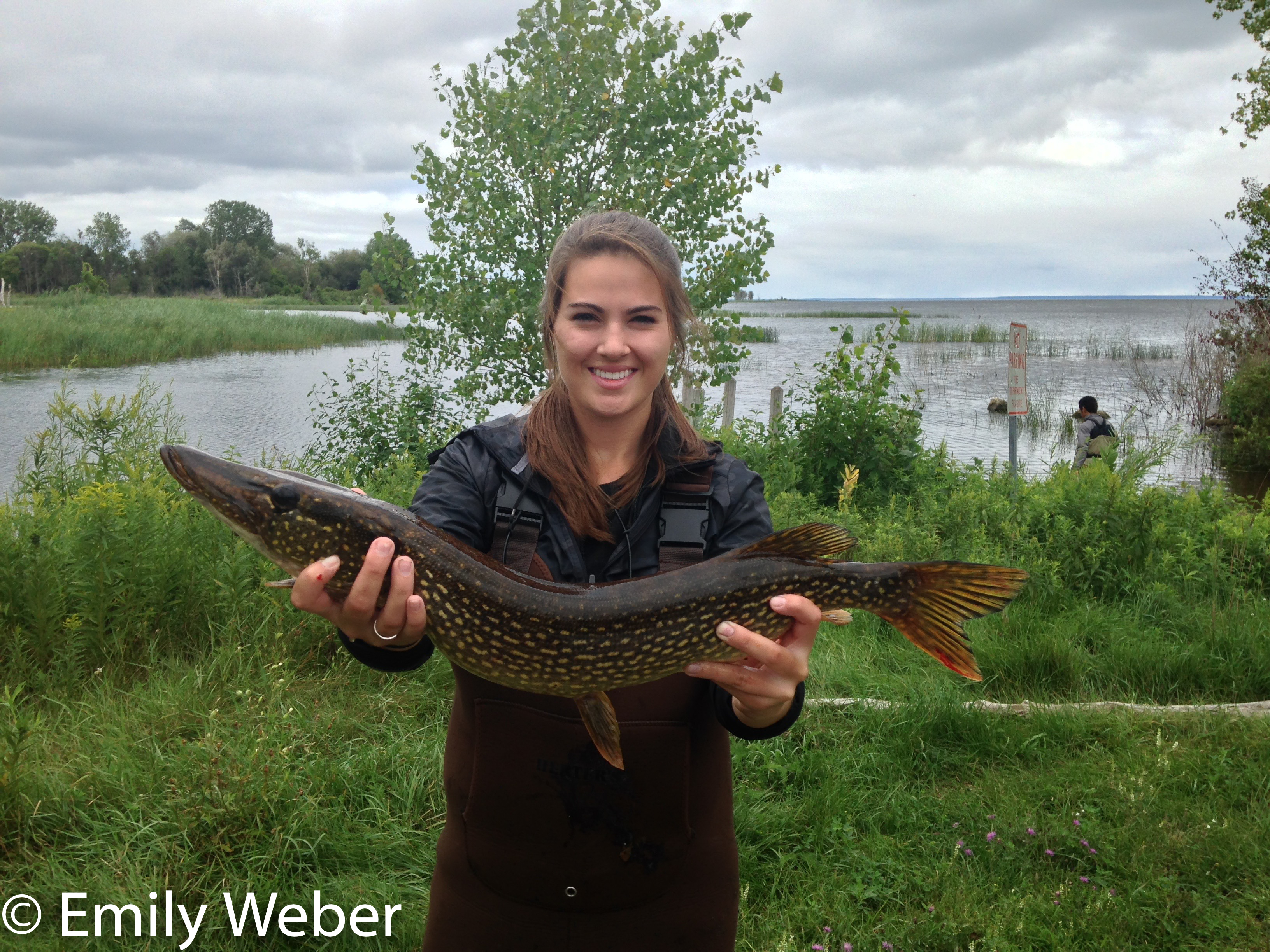 Female holding large Tributary Fish 