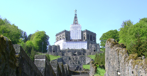 Stone ruins in front of a castle