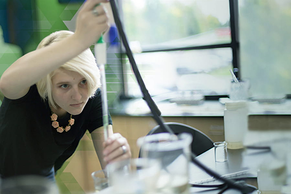 A UWGB, Manitowoc Campus student studies water samples.