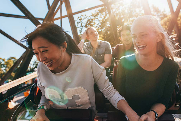 Students ride a rollercoaster.