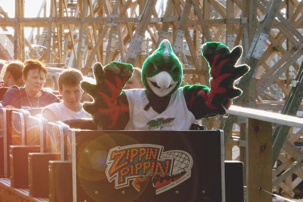 UWGB Phlash the Phoenix Mascot rideing the Zippin Pippin roller coaster at Bay Beach Amusement Park near campus