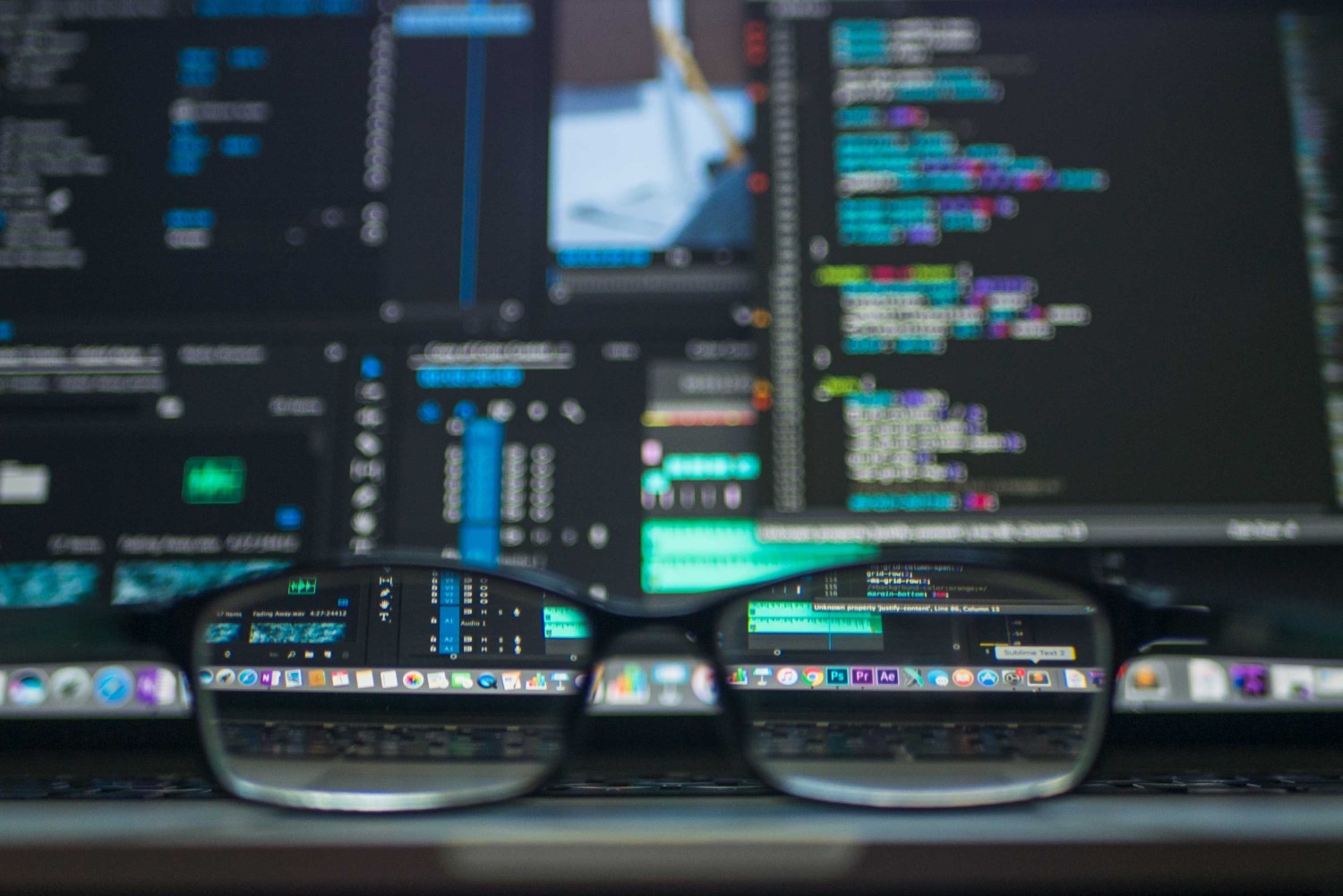 Close-up image of computer code with glasses