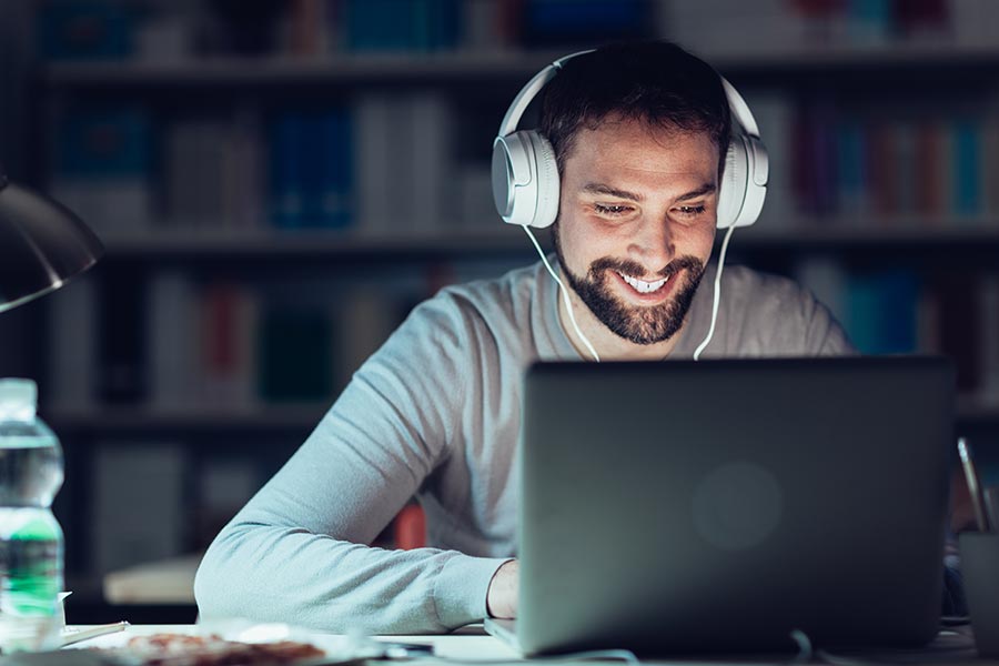 Online graduate student doing course work at night