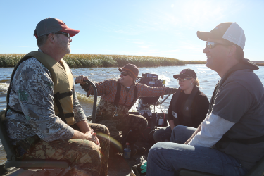 Four people on a boat