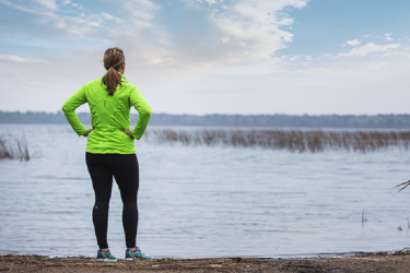 Woman looking out across water