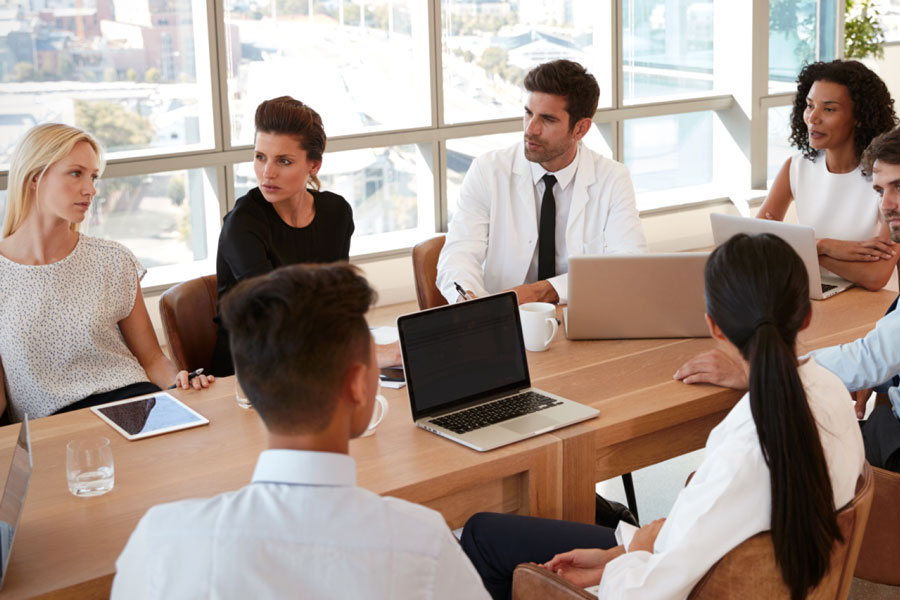 Diverse collegues attend meeting