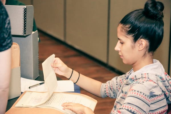 Students working with artifacts from the University Archives