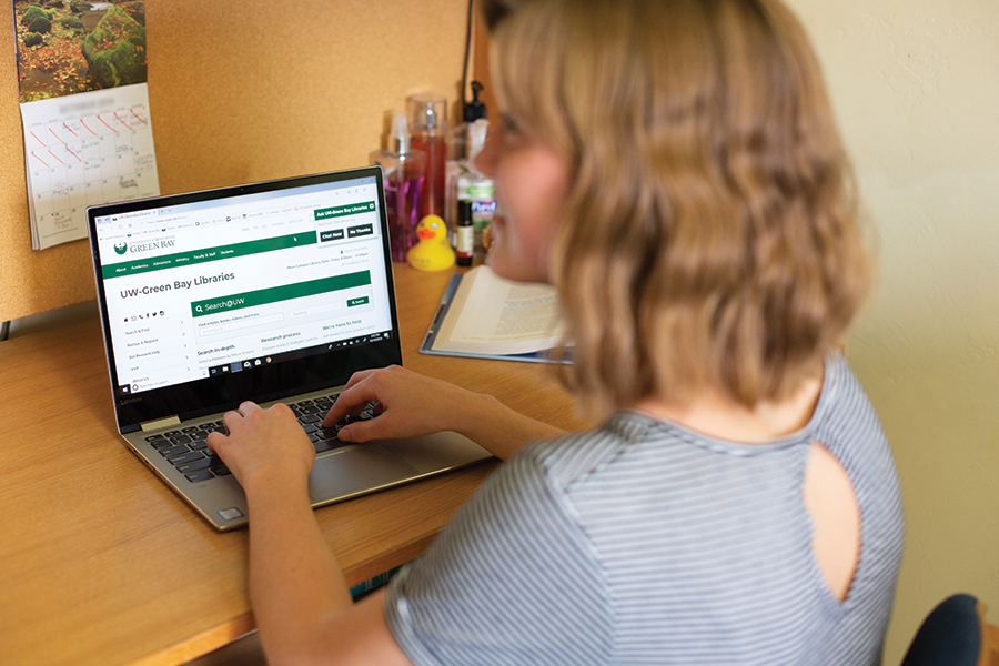 Student at her laptop using campus wifi