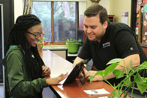 Student getting assistance at the uwgb housing front desk