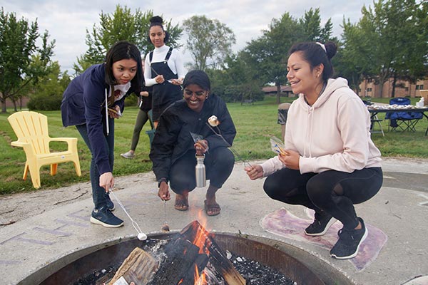 UWGB students roasting smores during GB Welcome.