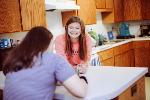 Students in the kitchen of one of the contemporary apartments