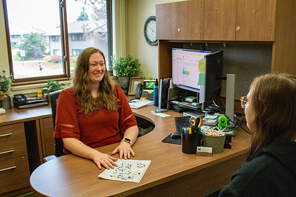 UWGB Area Coordinator meeting in her office with a student