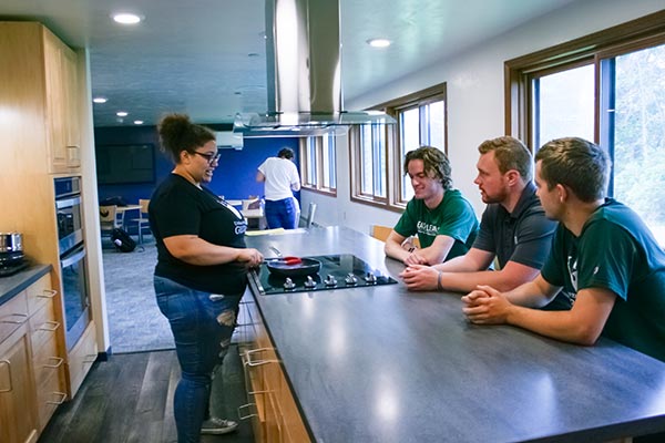 Students in a shared kitchen facility in one of the UWGB residence halls