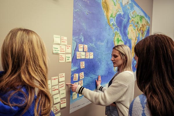 Students working on post-it note brainstorming activity