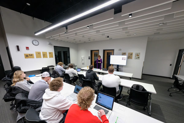 Students attend Professor Danielle Bina's lecture in the Frank Wood Media Newsroom