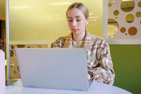 Female studies studies at lap top