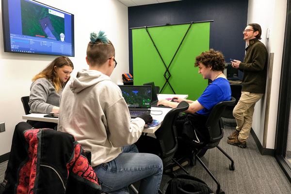 Students work with professor in the Center for Games & Interactive Media