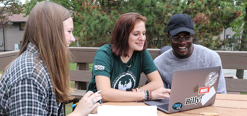Students working together on a laptop