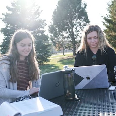 Students on laptops outside