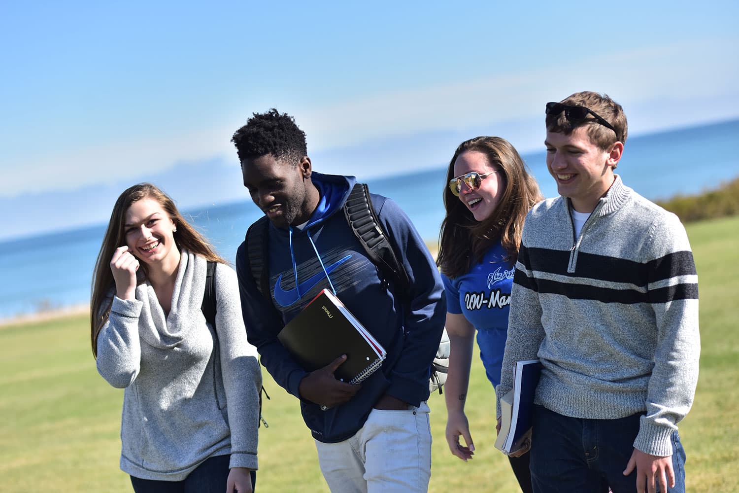 Students walking along the lakeshore in Manitowoc