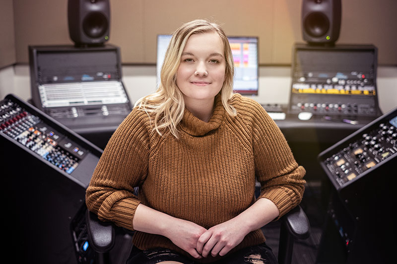 Audio production student in recording studio
