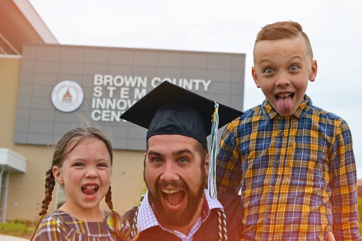 Graduate outside with family