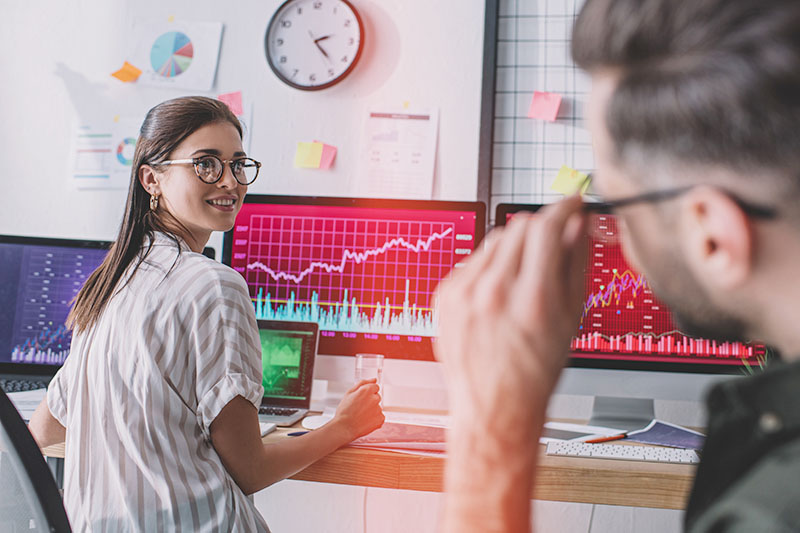 Data scientist smiling at coworker