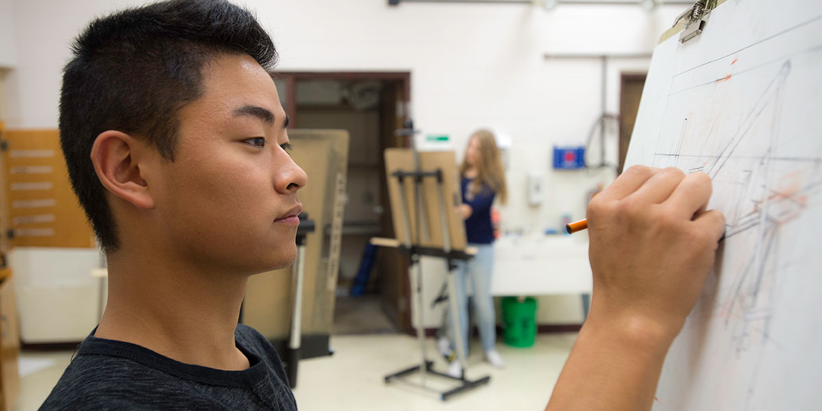 art student sketching at easel