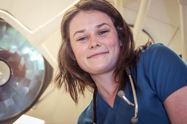 Photo looking up at nursing student from hospital bed Josie Klarkowski