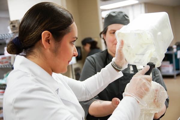 Student works with blender in STEM Center Kitchen