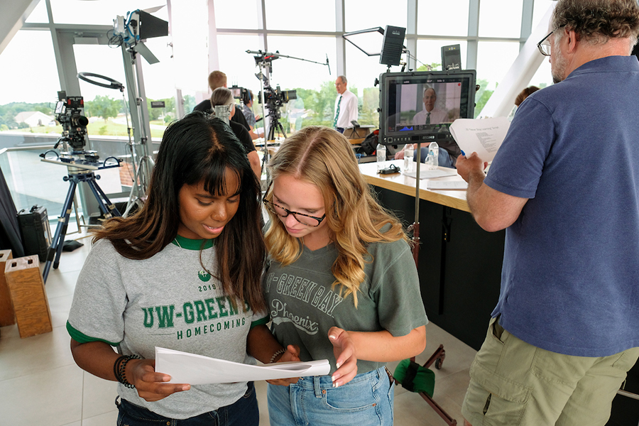 Interns working on video set