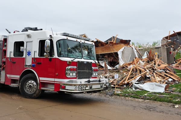Tornado destruction with fire truck emergency vehicle