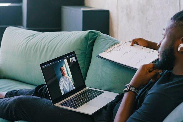 African American student attending online class