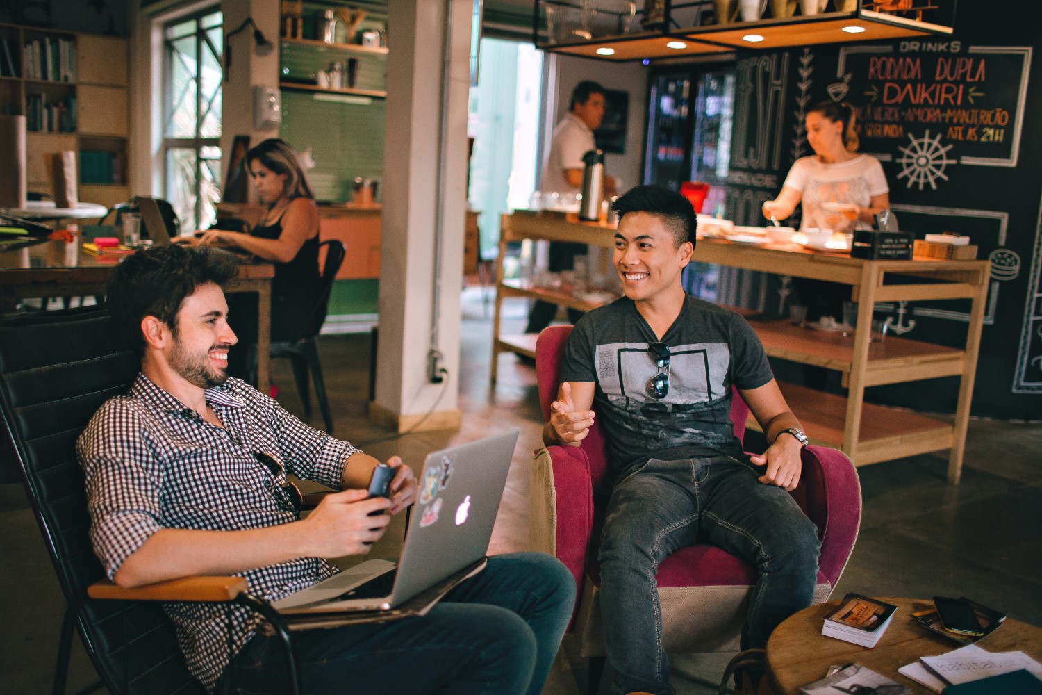 Coffee shop scene with discussion in the foreground