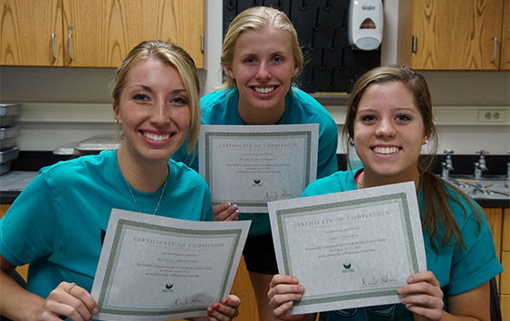 Three female students with scholarships