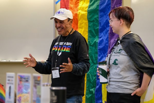 Pride Center interns talk with campers during a session at Pride Camp