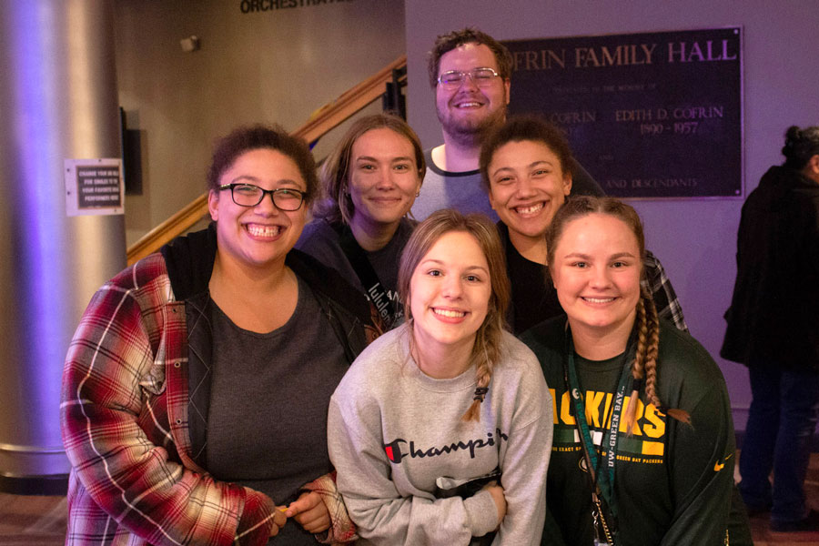 Group of students smile for photo