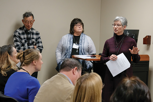 A faculty leader leads developmental group discussion.