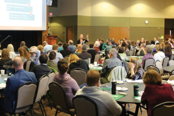 Large number of UWGB staff at an event.