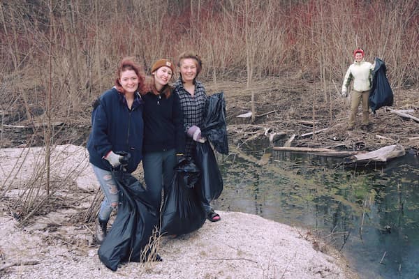Students volunteering in litter clean-up event